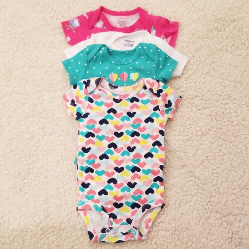Bundle of newborn onesies.